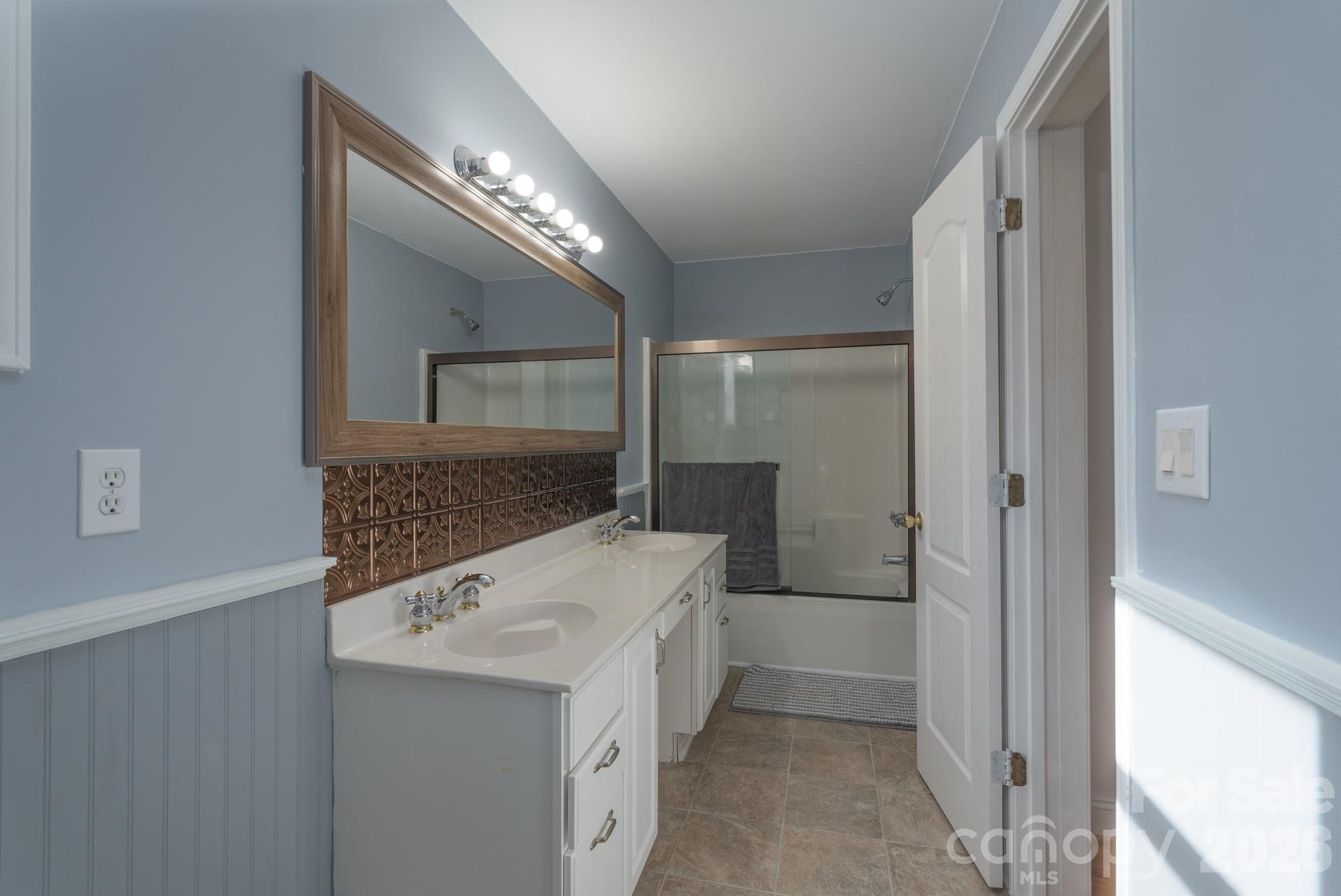 1491 Highway 160 Fort Mill, SC 29715 - Photo 11 of 19 a bathroom with a double vanity sink and mirror