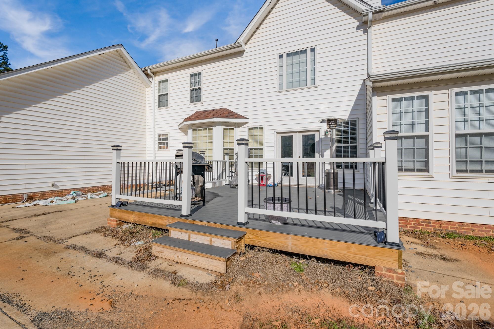 1491 Highway 160 Fort Mill, SC 29715 - Photo 16 of 19 a view of a house with a wooden deck