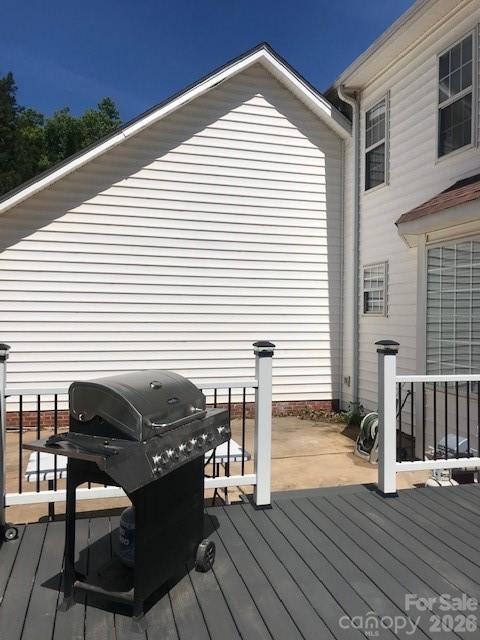 1491 Highway 160 Fort Mill, SC 29715 - Photo 17 of 19 a view of a roof deck with wooden floor and seating space