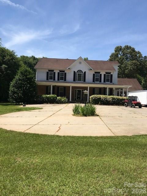 1491 Highway 160 Fort Mill, SC 29715 - Photo 19 of 19 a front view of a house with a yard and trees