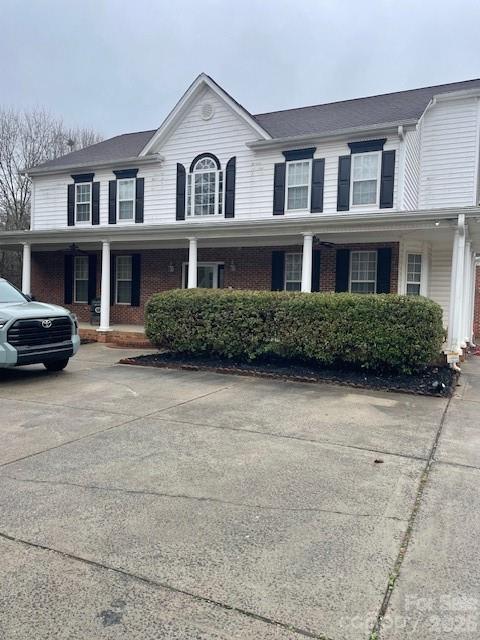 1491 Highway 160 Fort Mill, SC 29715 - Photo 2 of 19 a front view of a house with a garden