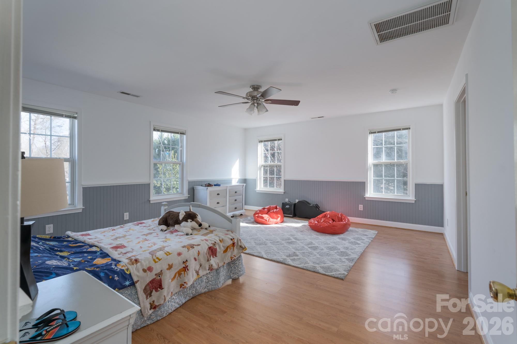 1491 Highway 160 Fort Mill, SC 29715 - Photo 8 of 19 a bedroom with a bed and wooden floor