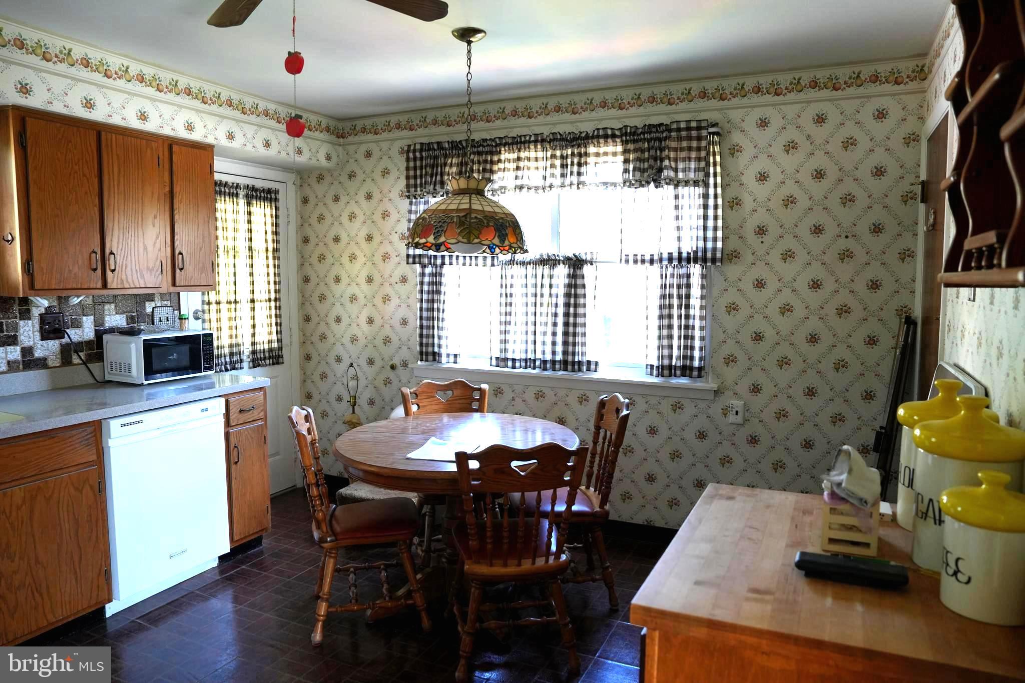 4741 River Road Pennsauken, NJ 08110 - Photo 15 of 26 a kitchen with a table chairs and a window