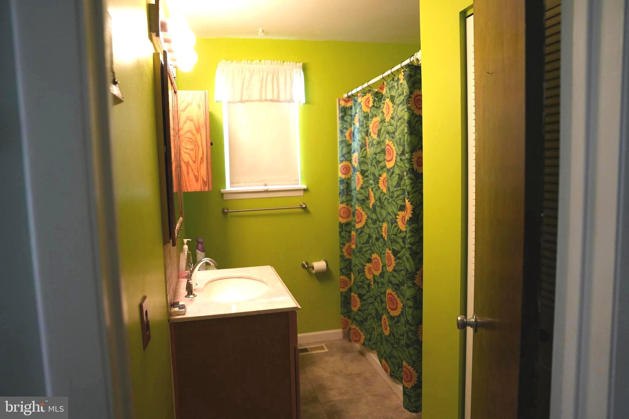 4741 River Road Pennsauken, NJ 08110 - Photo 17 of 26 a bathroom with a sink and mirror