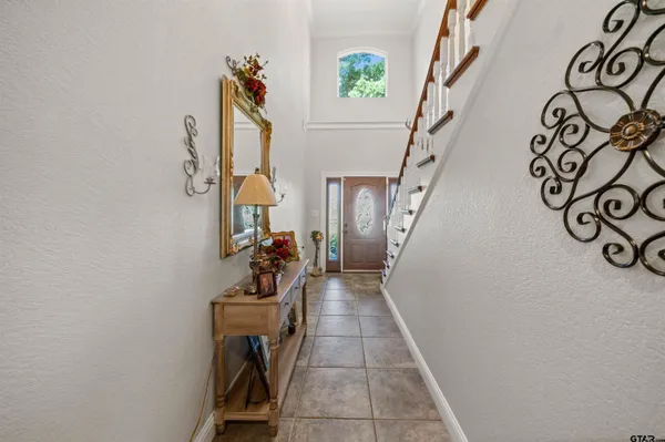 a view of a entryway with stairs and furniture
