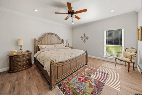 a bed room with a bed and a chandelier