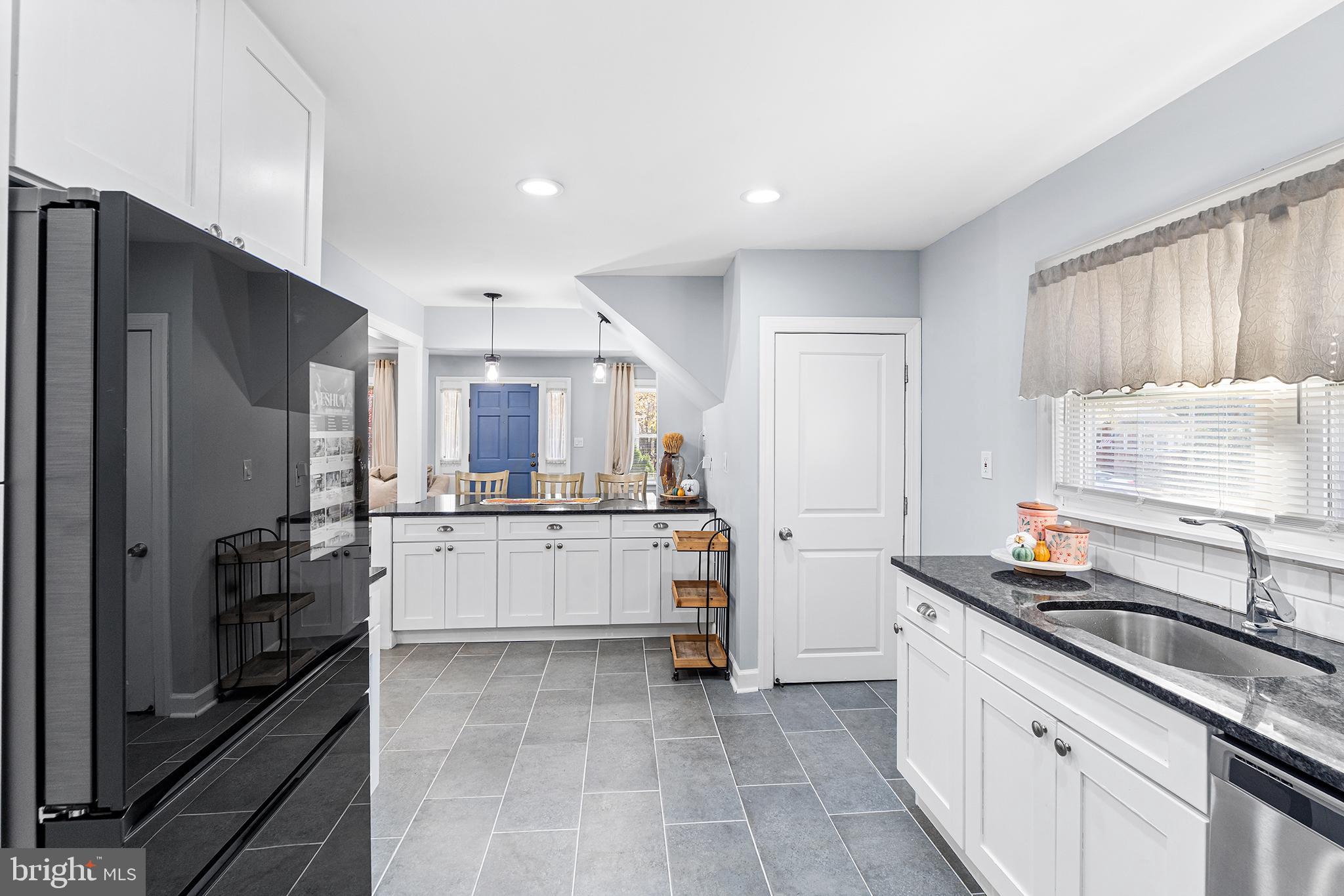 14 Nicholson Road West Collingswood Heights, NJ 08059 - Photo 21 of 50 a kitchen with white cabinets and appliances