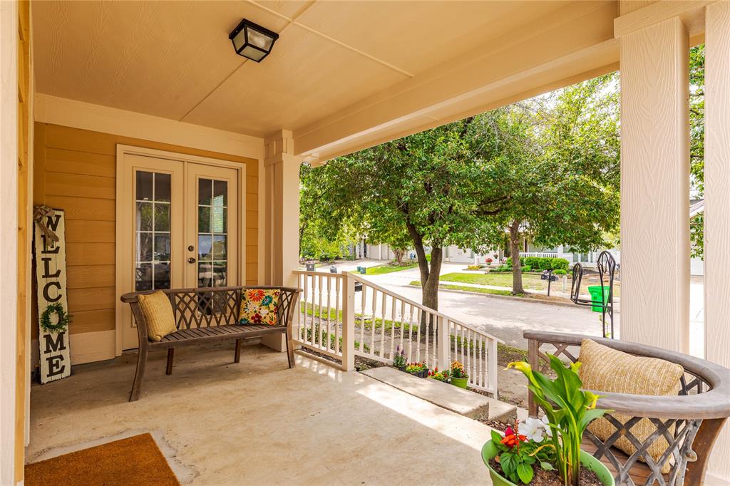 a balcony with furniture and garden view