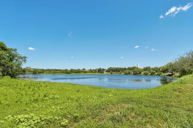 a view of a lake and sunset