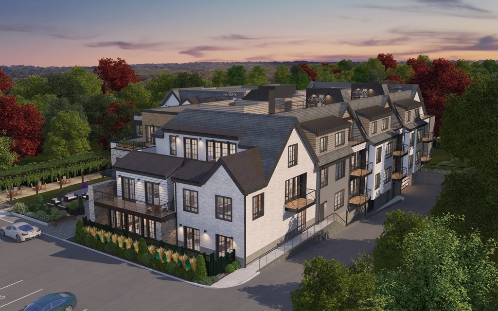 148 Weston Road, Unit 203 Wellesley, MA 02482 - Photo 4 of 11 an aerial view of multiple houses with a yard