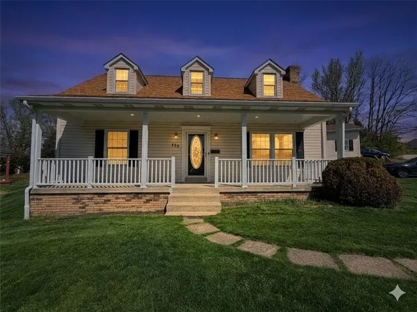 a front view of a house with a yard