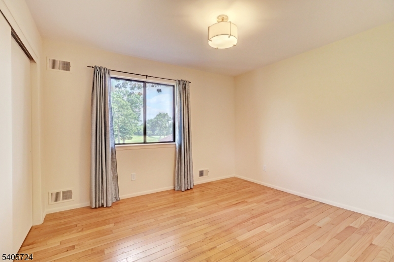 250 Ridgedale Avenue, Unit 4 Florham Park, NJ 07932 - Photo 17 of 24 a bedroom with a bed and a window