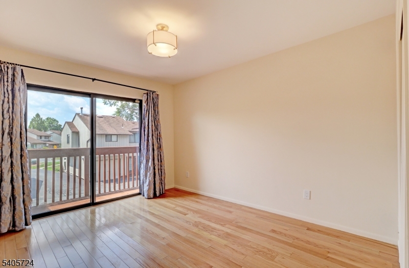 250 Ridgedale Avenue, Unit 4 Florham Park, NJ 07932 - Photo 18 of 24 wooden floor in an empty room with a window