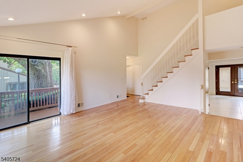 250 Ridgedale Avenue, Unit 4 Florham Park, NJ 07932 - Photo 6 of 24 a view of empty room with wooden floor and fan