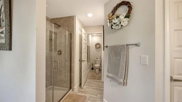 a bathroom with a mirror sink and shower