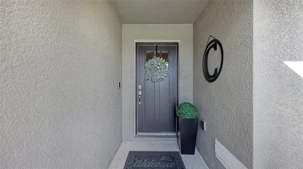 a view of a hallway with wooden door