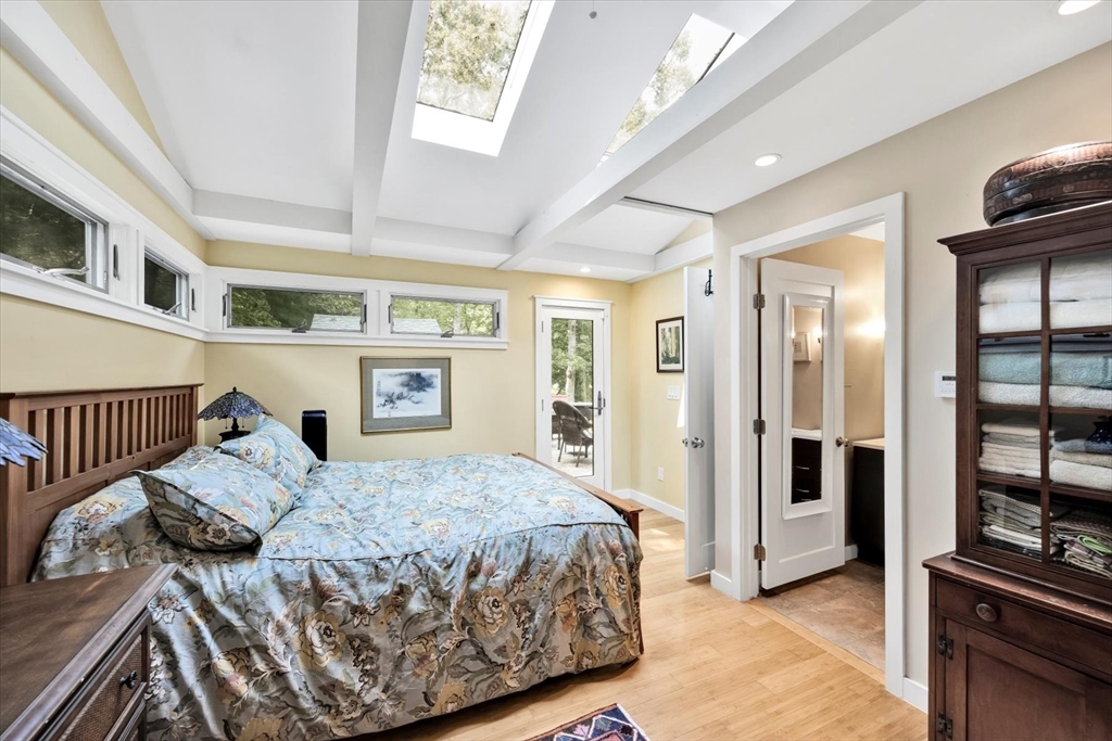 67 Cliff Road Bourne, MA 02532 - Photo 13 of 36 a bedroom with a large bed and a window