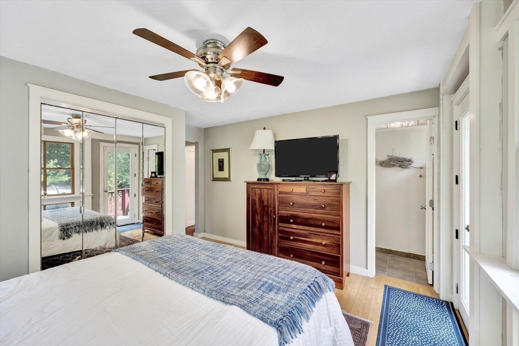 67 Cliff Road Bourne, MA 02532 - Photo 20 of 36 a bedroom with a bed and a flat screen tv