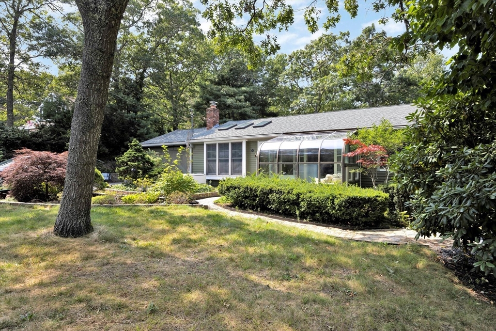 67 Cliff Road Bourne, MA 02532 - Photo 2 of 36 a view of a house with a yard