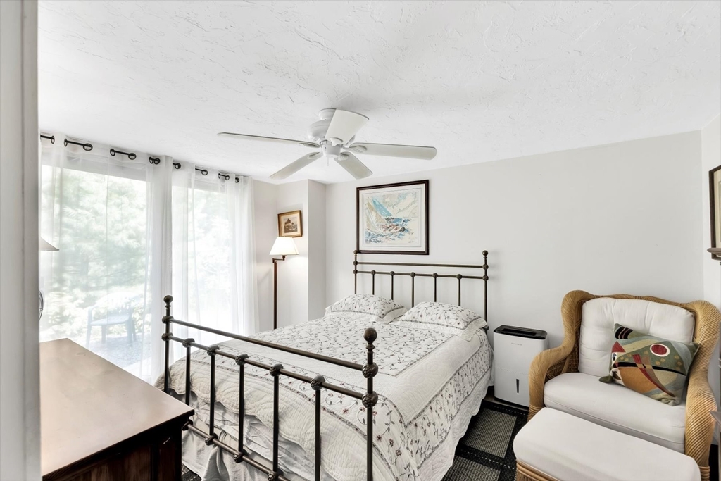 67 Cliff Road Bourne, MA 02532 - Photo 31 of 36 a bedroom with furniture and a window