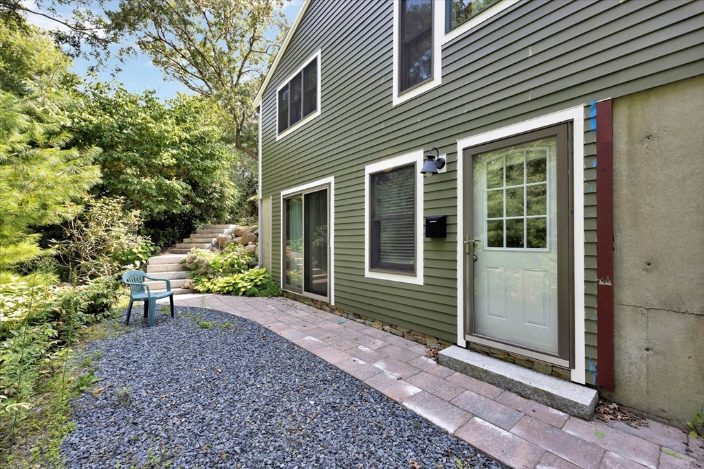 67 Cliff Road Bourne, MA 02532 - Photo 6 of 36 a view of a house with a yard