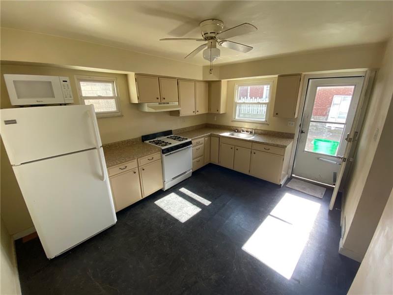 652 Evergreen Road Pittsburgh, PA 15209 - Photo 8 of 21 kitchen leading to side porch~all appliances stay!