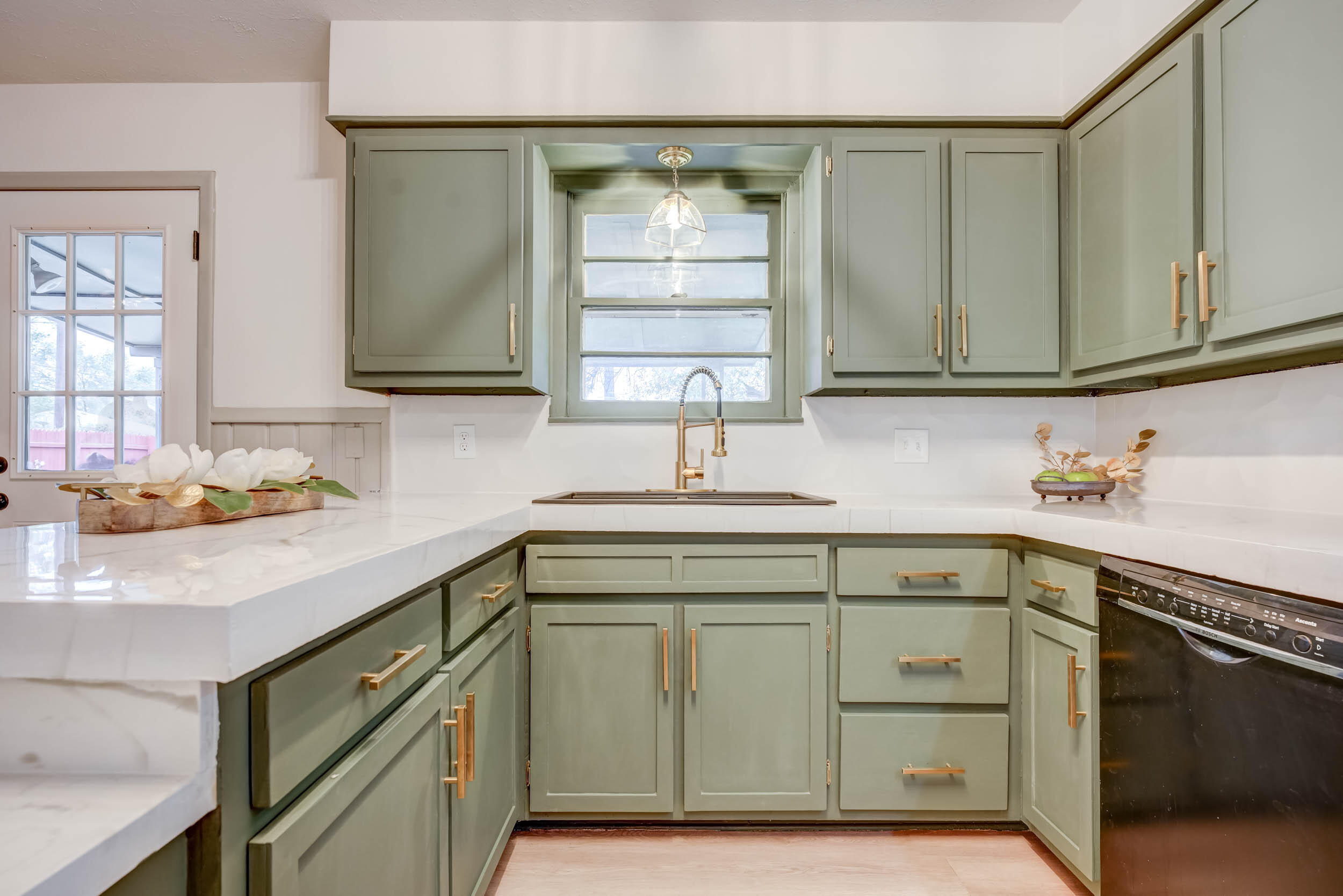 2101 64th Street Lubbock, TX 79412 - Photo 14 of 30 a kitchen with cabinets and window