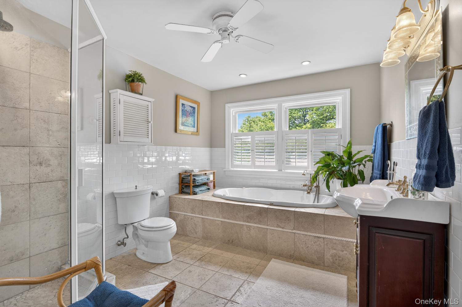 17 Riggs Place Locust Valley, NY 11560 - Photo 22 of 25 Primary bedroom with spa tub and separate shower