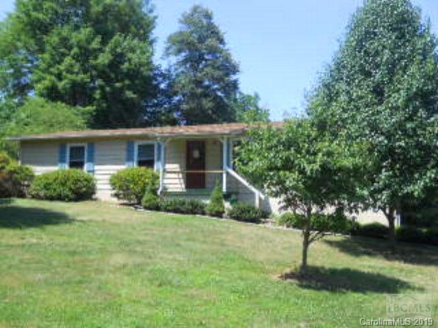 5548 Morris Loop Morganton, NC 28655 - Photo 1 of 1 a backyard of a house with plants and large tree