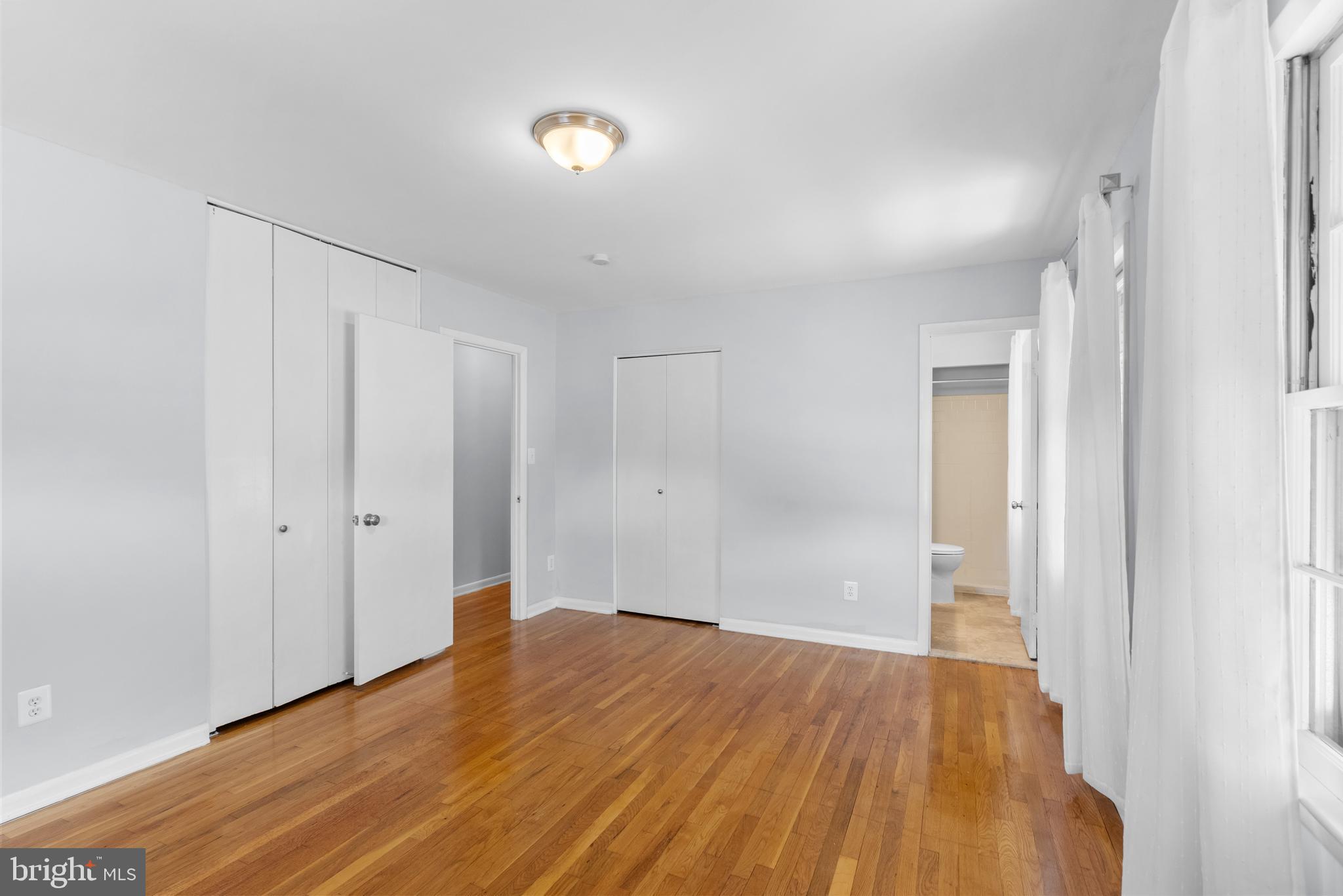 1201 Chillum Manor Road Hyattsville, MD 20783 - Photo 26 of 49 a view of a room with wooden floor and white doors