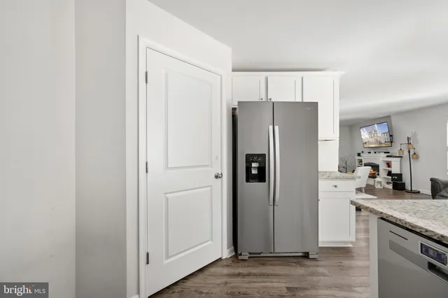 a bathroom with a sink a toilet and shower curtain