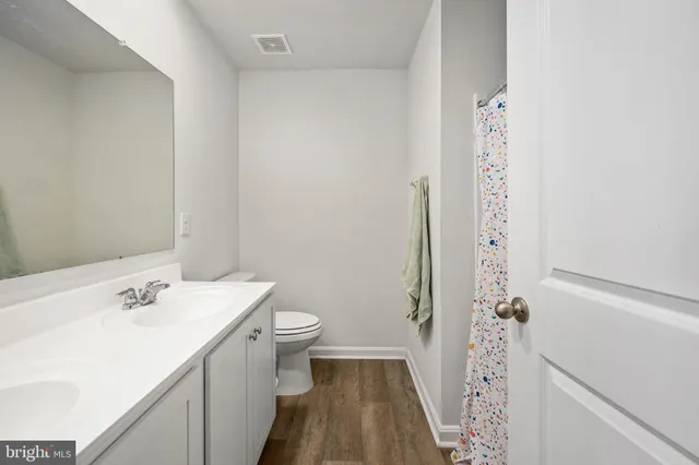 a living room with furniture and stairs