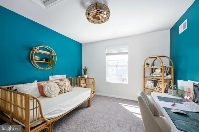 a front view of a building with sitting area