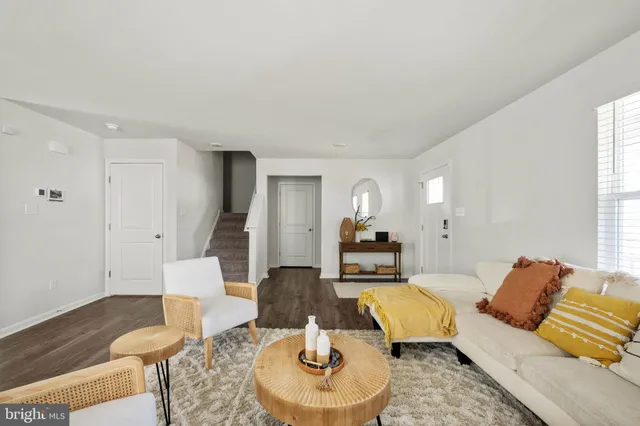 a bathroom with a granite countertop toilet a sink and a mirror