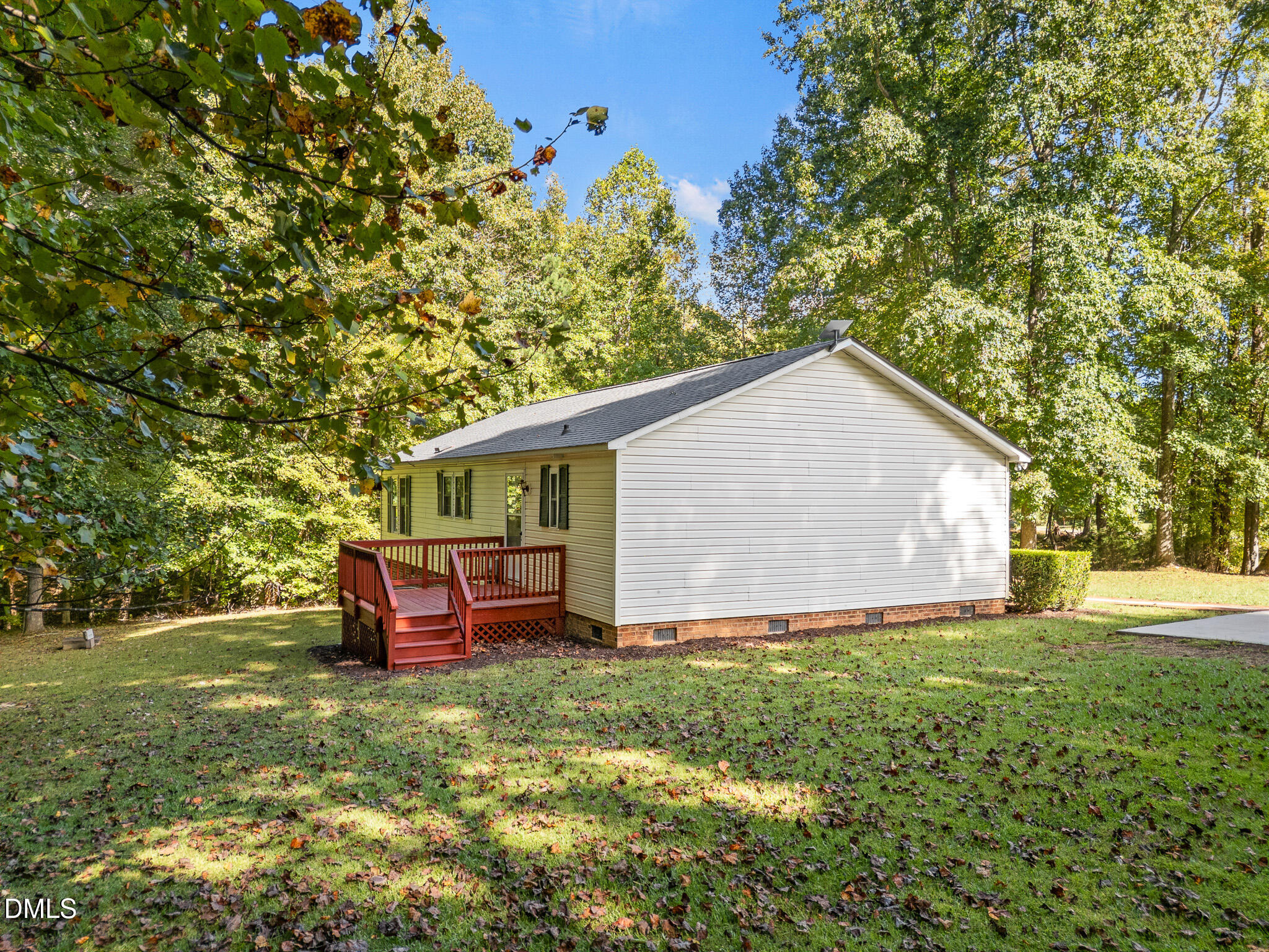 4551 Sugar Maple Road Oxford, NC 27565 - Photo 16 of 23 a backyard of a house with table and chairs