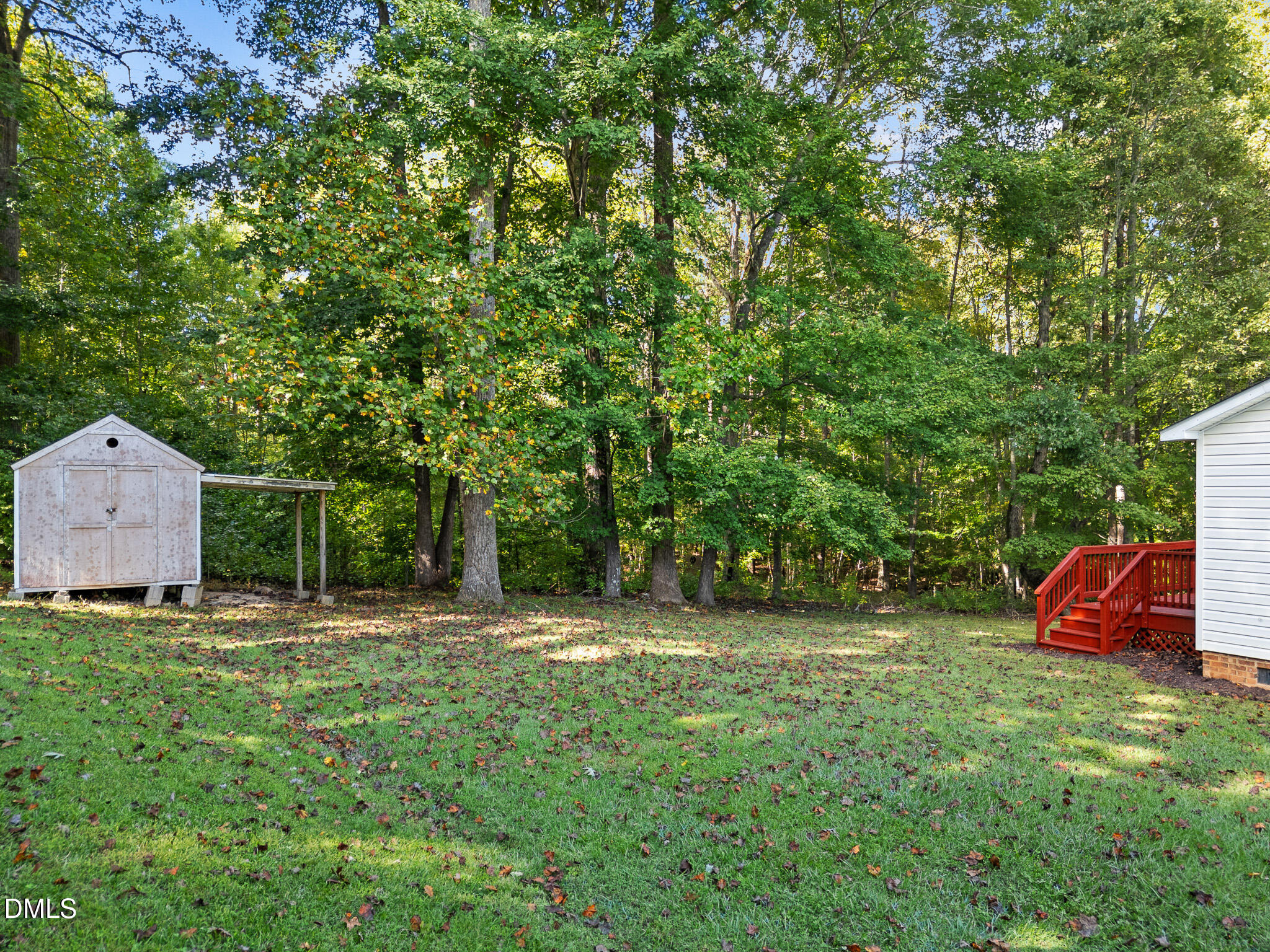 4551 Sugar Maple Road Oxford, NC 27565 - Photo 17 of 23 a backyard of a house with table and chairs