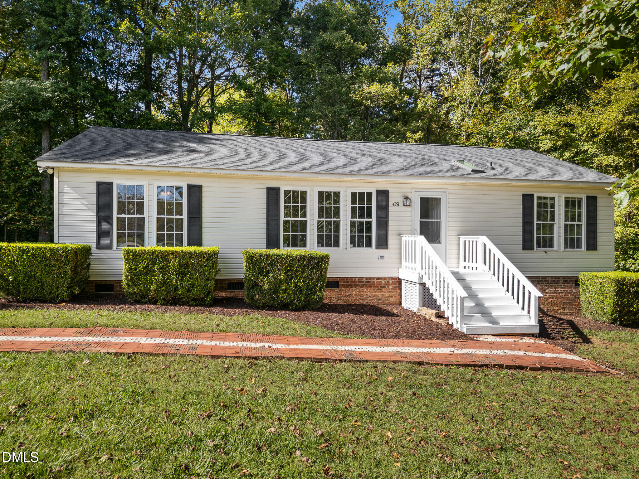4551 Sugar Maple Road Oxford, NC 27565 - Photo 2 of 23 a view of a house with backyard sitting area and garden