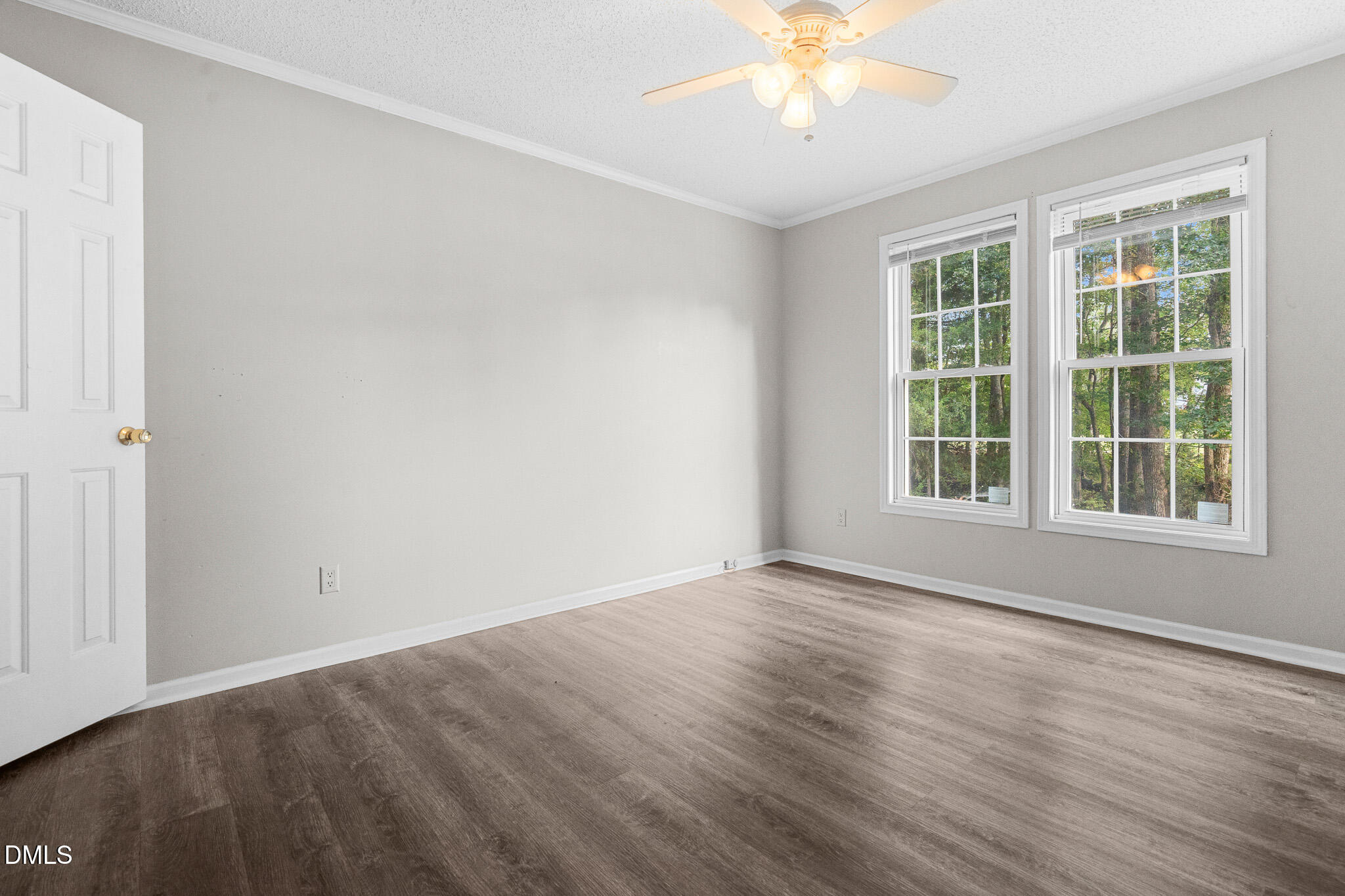 4551 Sugar Maple Road Oxford, NC 27565 - Photo 7 of 23 a view of an empty room with wooden floor and a window