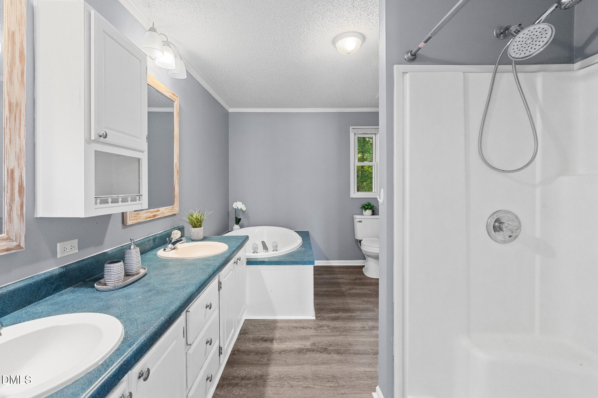 4551 Sugar Maple Road Oxford, NC 27565 - Photo 10 of 23 a bathroom with a granite countertop sink a mirror a shower and a bathtub