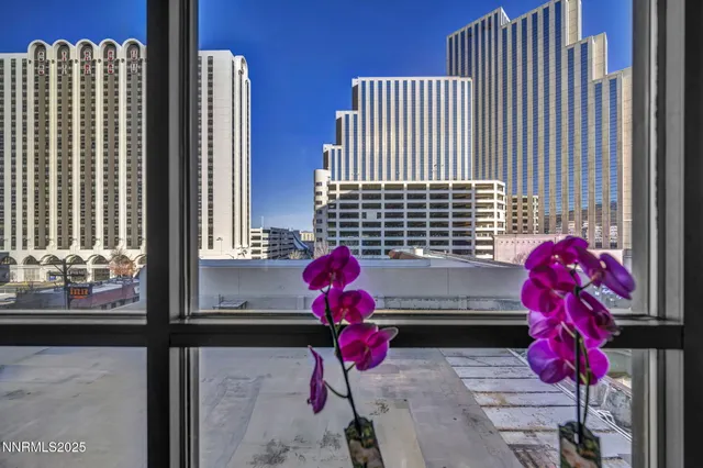 a bathroom with a granite countertop sink a toilet and a mirror
