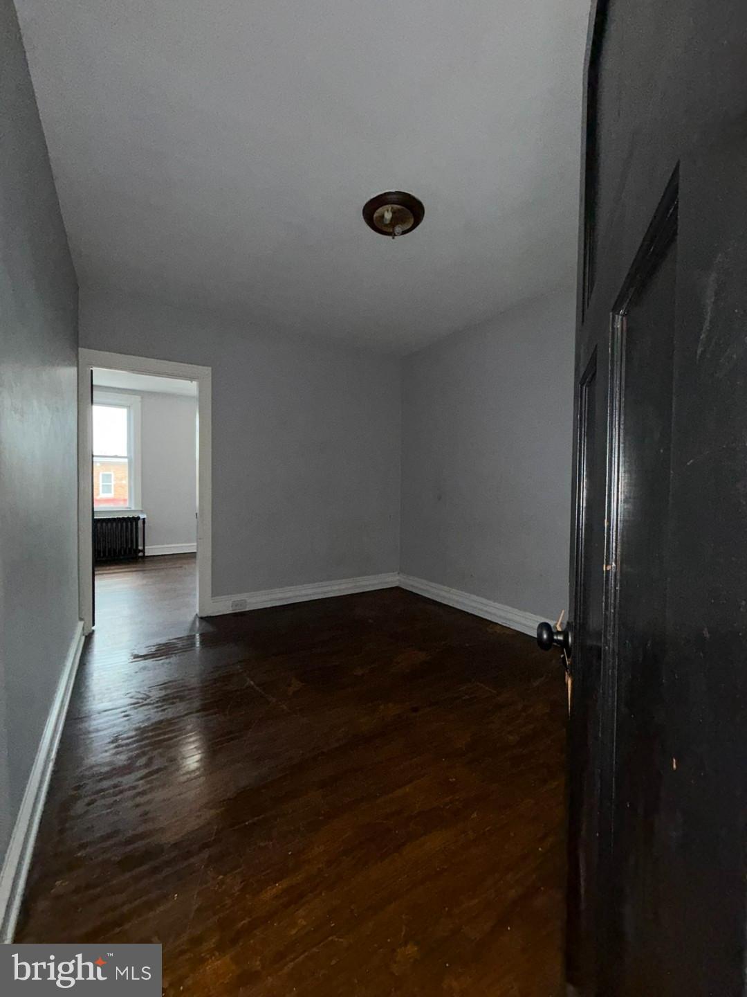 2606 Beryl Avenue Baltimore, MD 21205 - Photo 20 of 39 a view of empty room with wooden floor