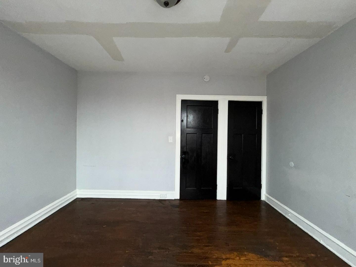 2606 Beryl Avenue Baltimore, MD 21205 - Photo 24 of 39 a view of an empty room with wooden floor