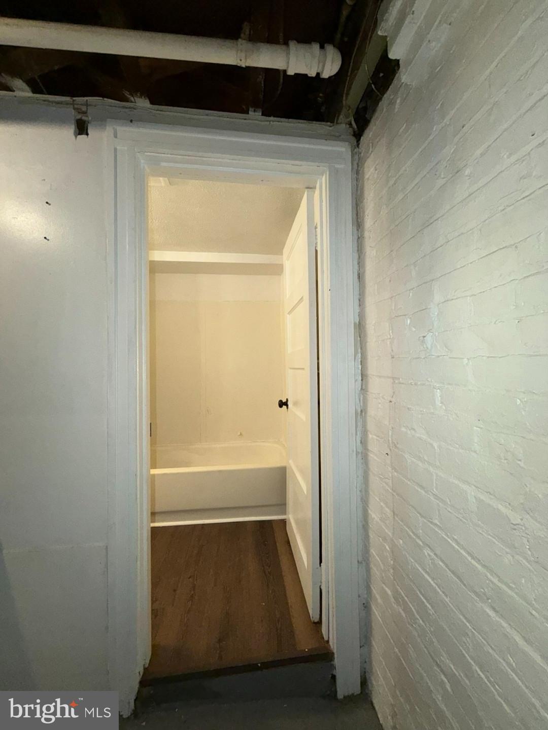 2606 Beryl Avenue Baltimore, MD 21205 - Photo 34 of 39 a bathroom with a tub and shower