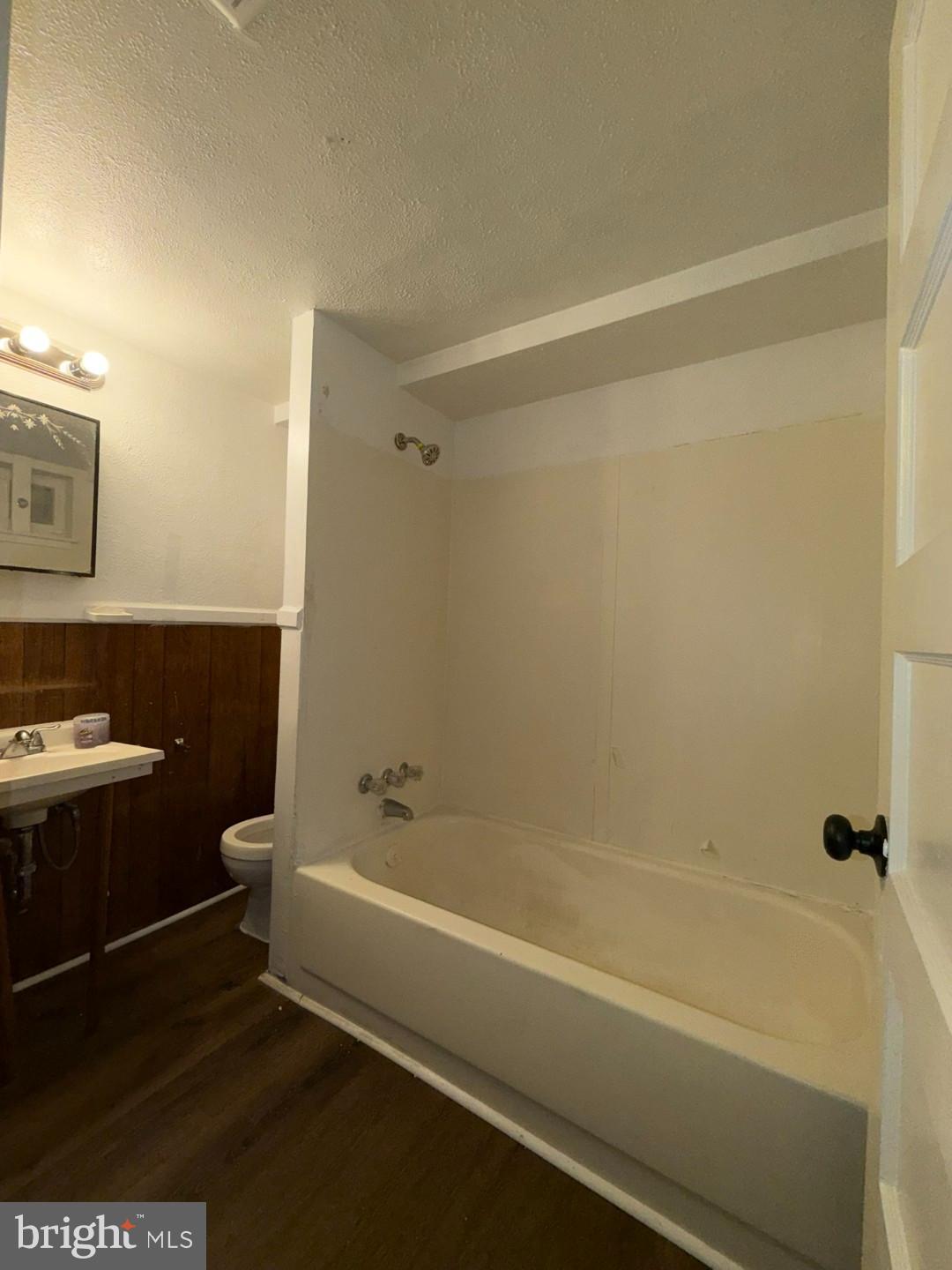 2606 Beryl Avenue Baltimore, MD 21205 - Photo 35 of 39 a bathroom with a bathtub and a sink