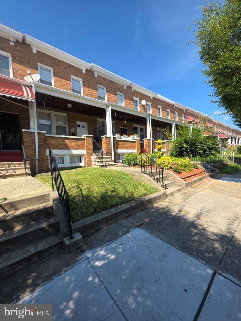 2606 Beryl Avenue Baltimore, MD 21205 - Photo 36 of 39 a view of a patio with table and chairs with wooden floor and fence