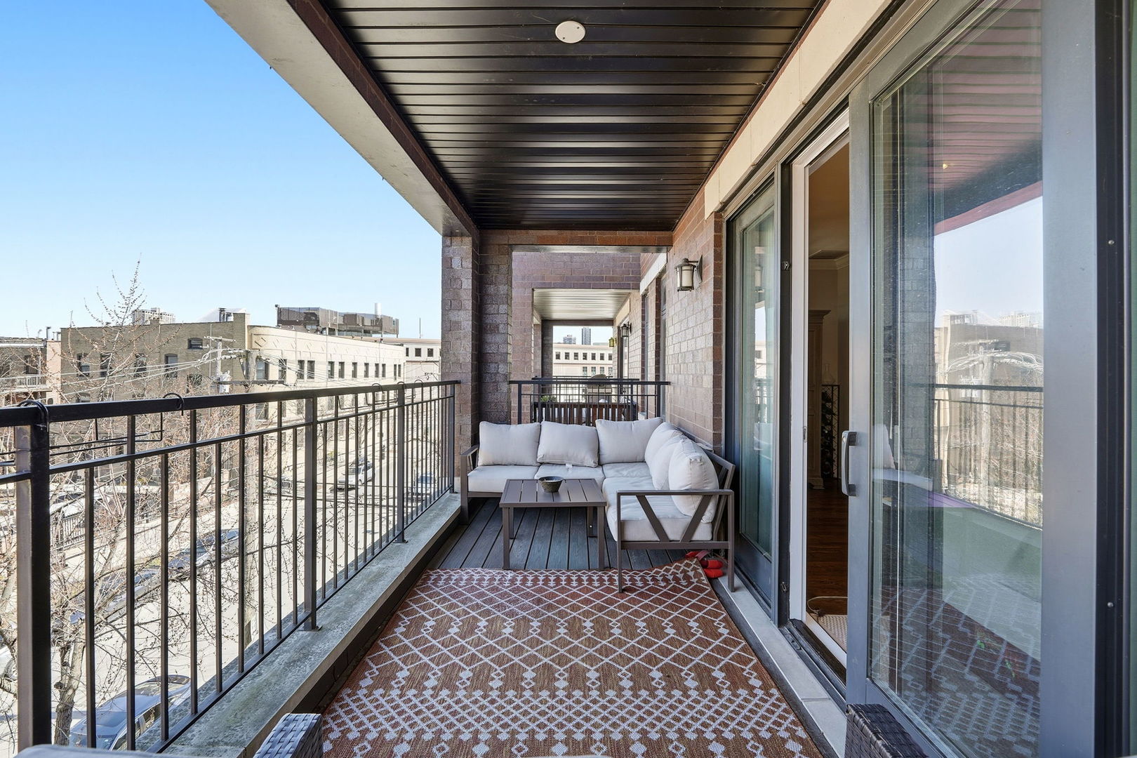 843 West Fletcher Street, Unit 3W Chicago, IL 60657 - Photo 23 of 45 a view of a balcony with wooden floor