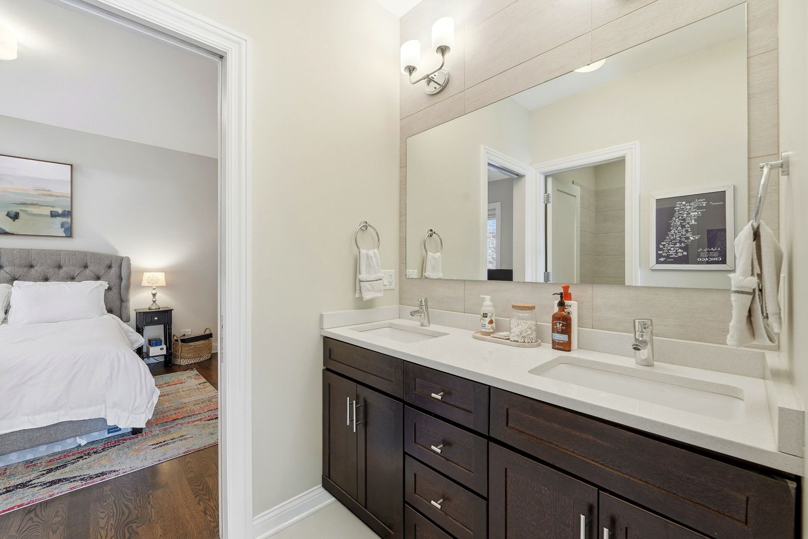 843 West Fletcher Street, Unit 3W Chicago, IL 60657 - Photo 28 of 45 a en suite bathroom with a double vanity sink and a mirror