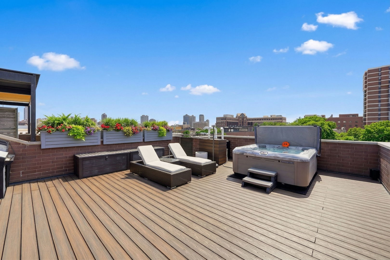 843 West Fletcher Street, Unit 3W Chicago, IL 60657 - Photo 33 of 45 a view of roof deck with couches and wooden floor