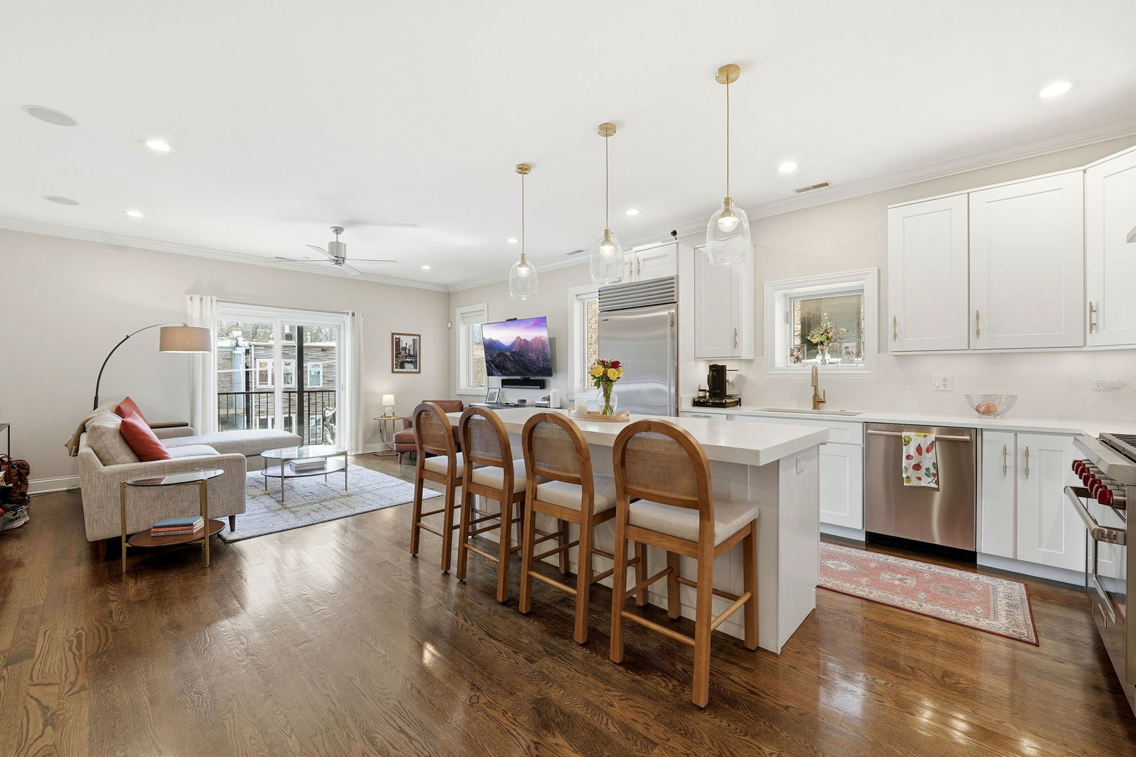 843 West Fletcher Street, Unit 3W Chicago, IL 60657 - Photo 7 of 45 a view of kitchen center island and wooden floor