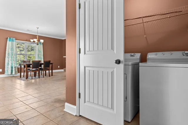 a view of a livingroom with furniture and entryway